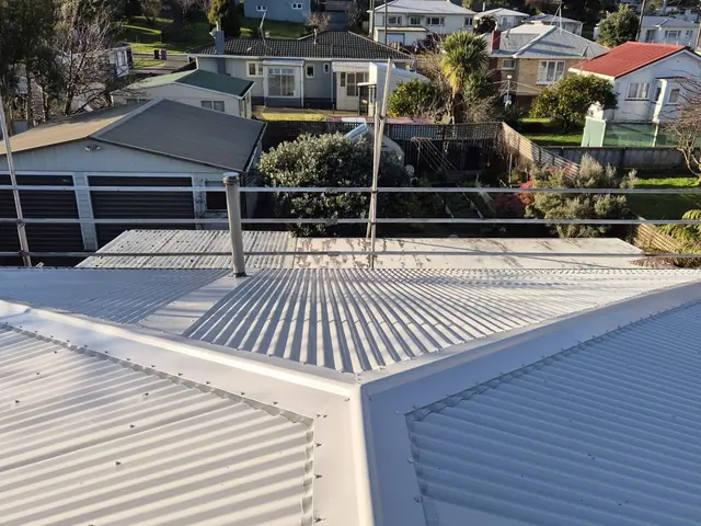 New long-run Colorsteel roof with a clean hip and ridge